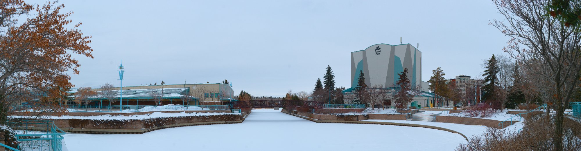 Strathcona County winter panorama with frozen canal and teal architecture